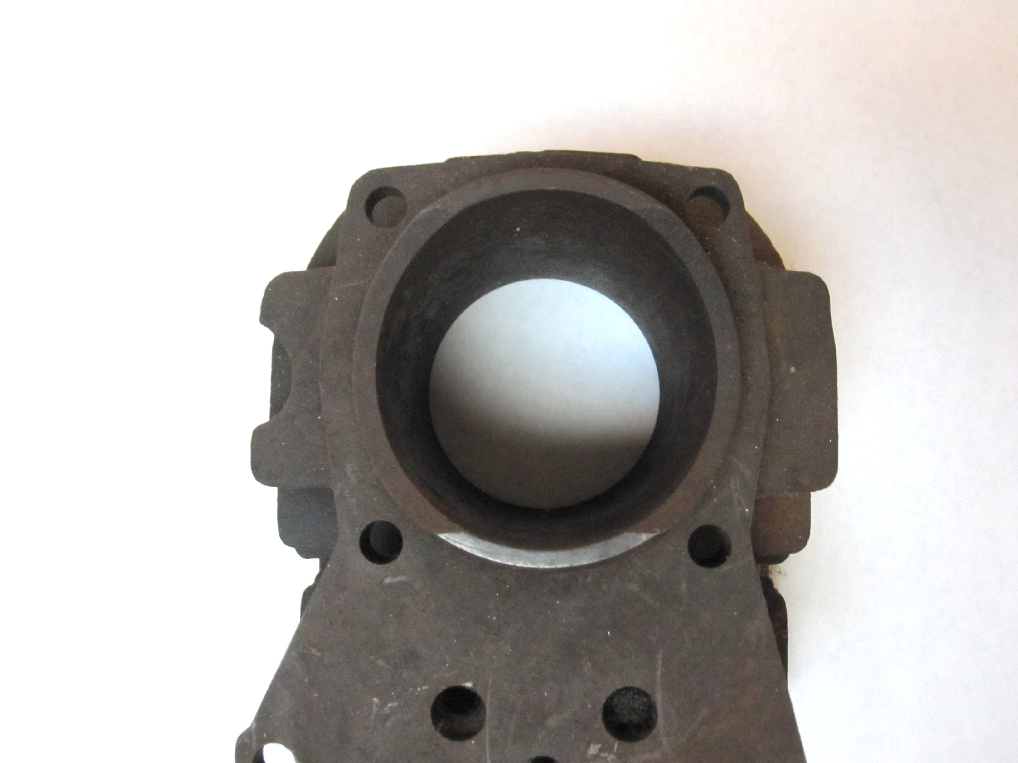 It's a vintage Kohler KT series engine cylinder. It's identified by the