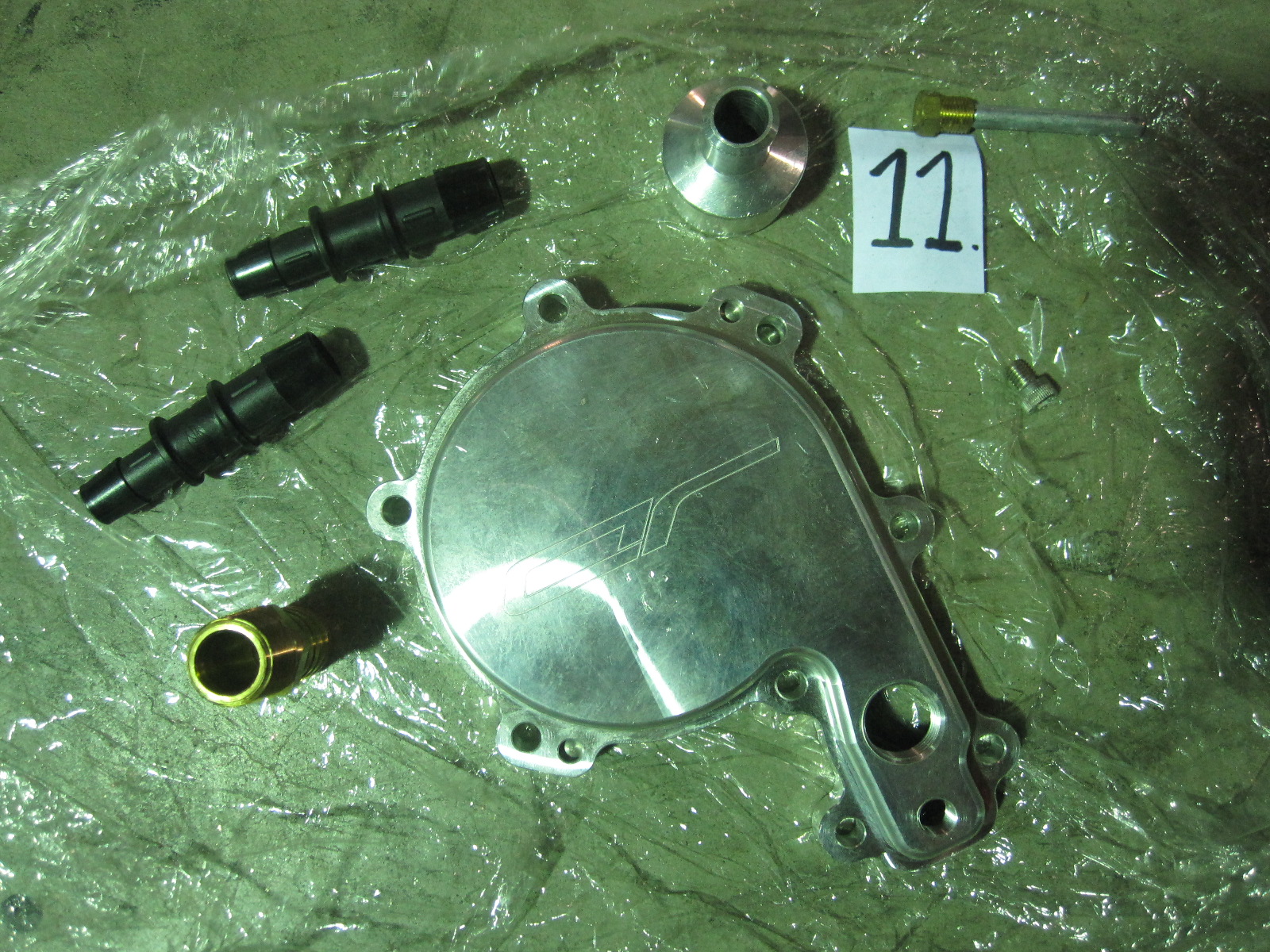 It's an aftermarket water pump cover for 1.5L Rotax powered SeaDoos. I