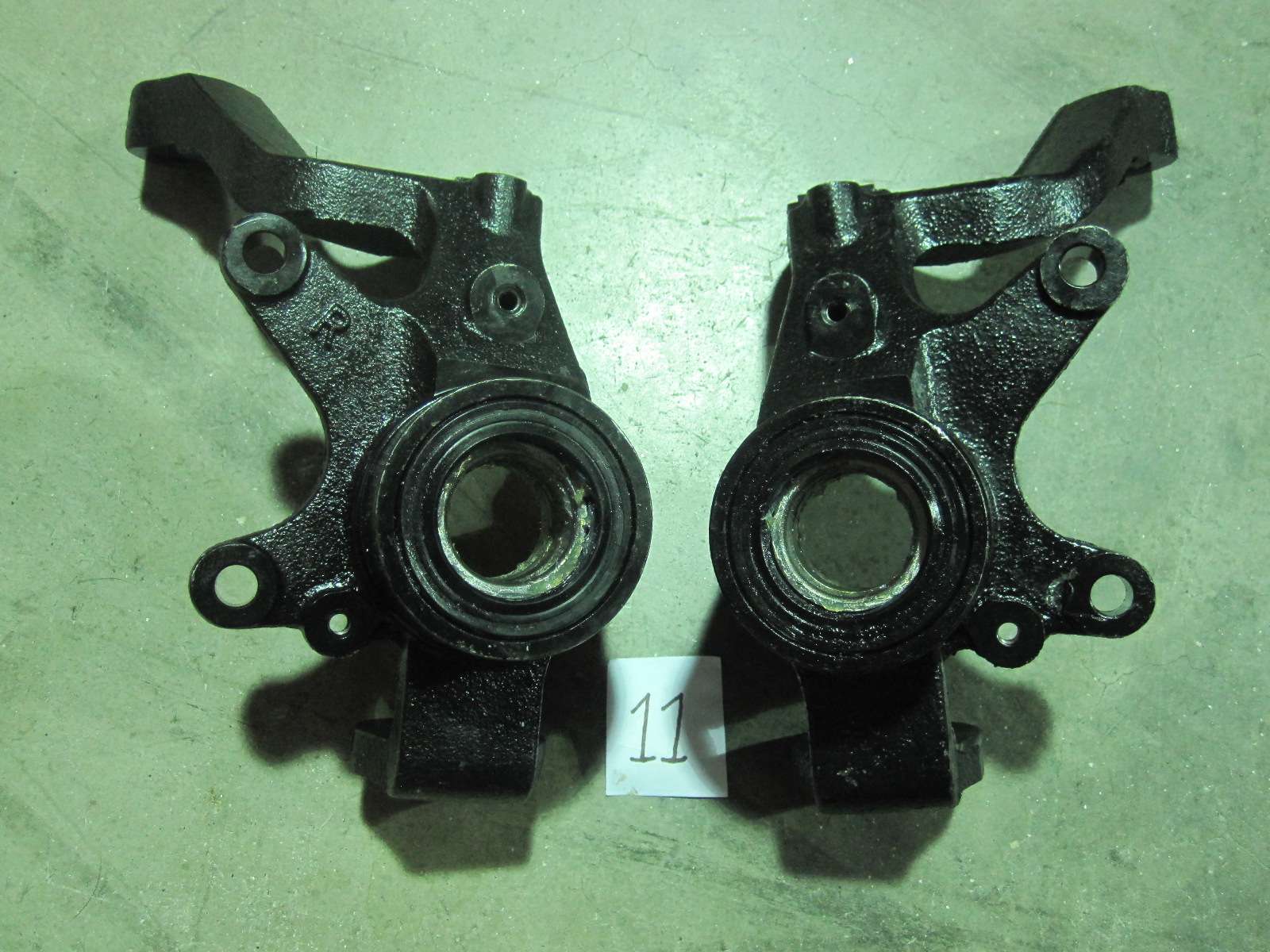 This is a pair of Yamaha Rhino steering knuckles. OEM part numbers are