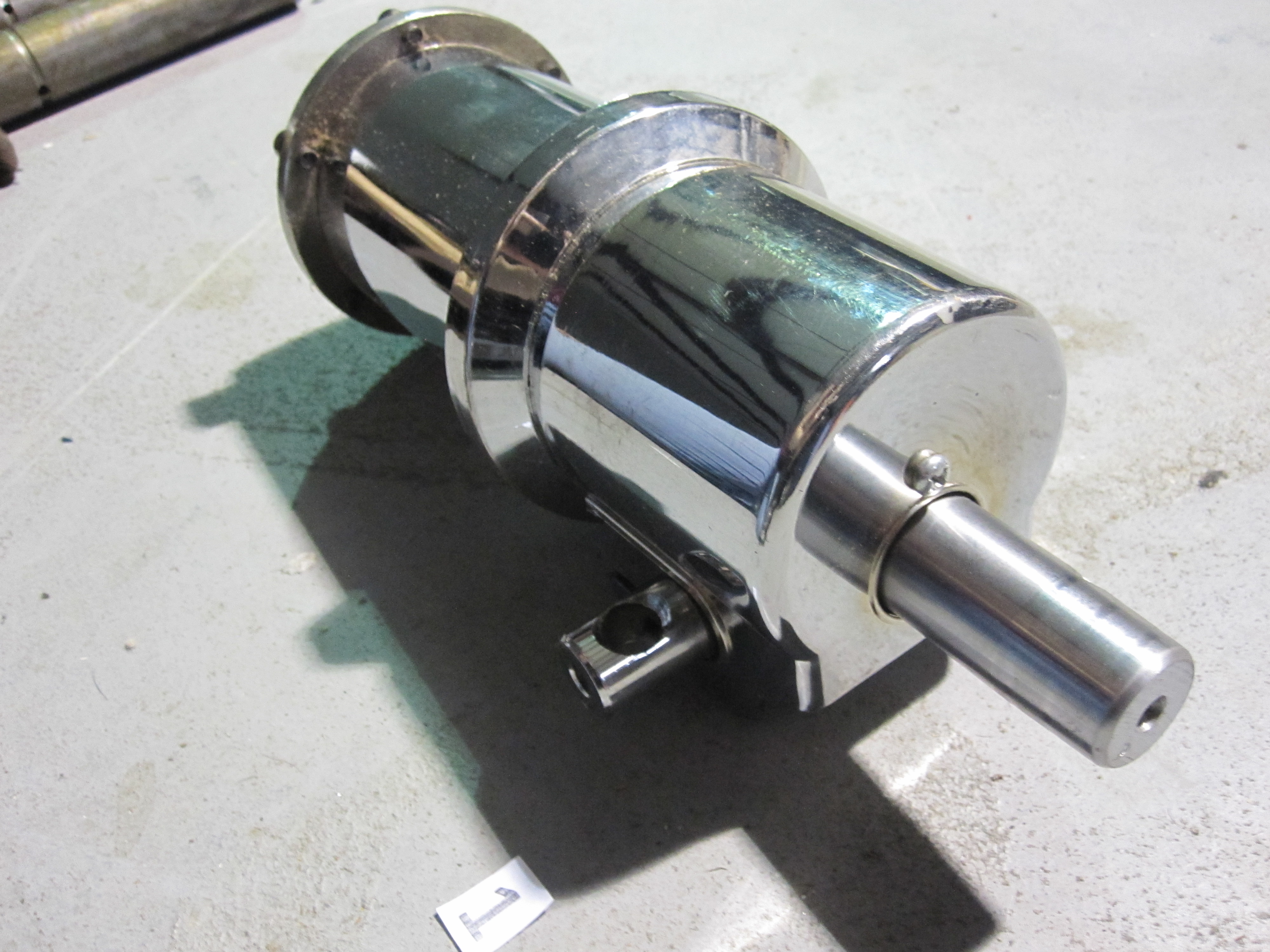 It's a hydraulic pump, for raising/lowering a barber chair. 233