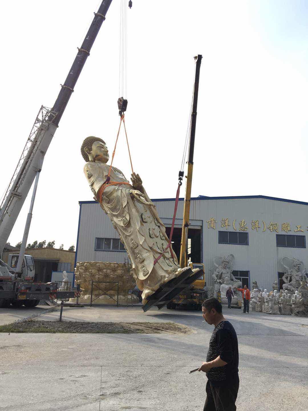 Buddha Statue Lands... Edmonton Buddhist Research Institute anxiously