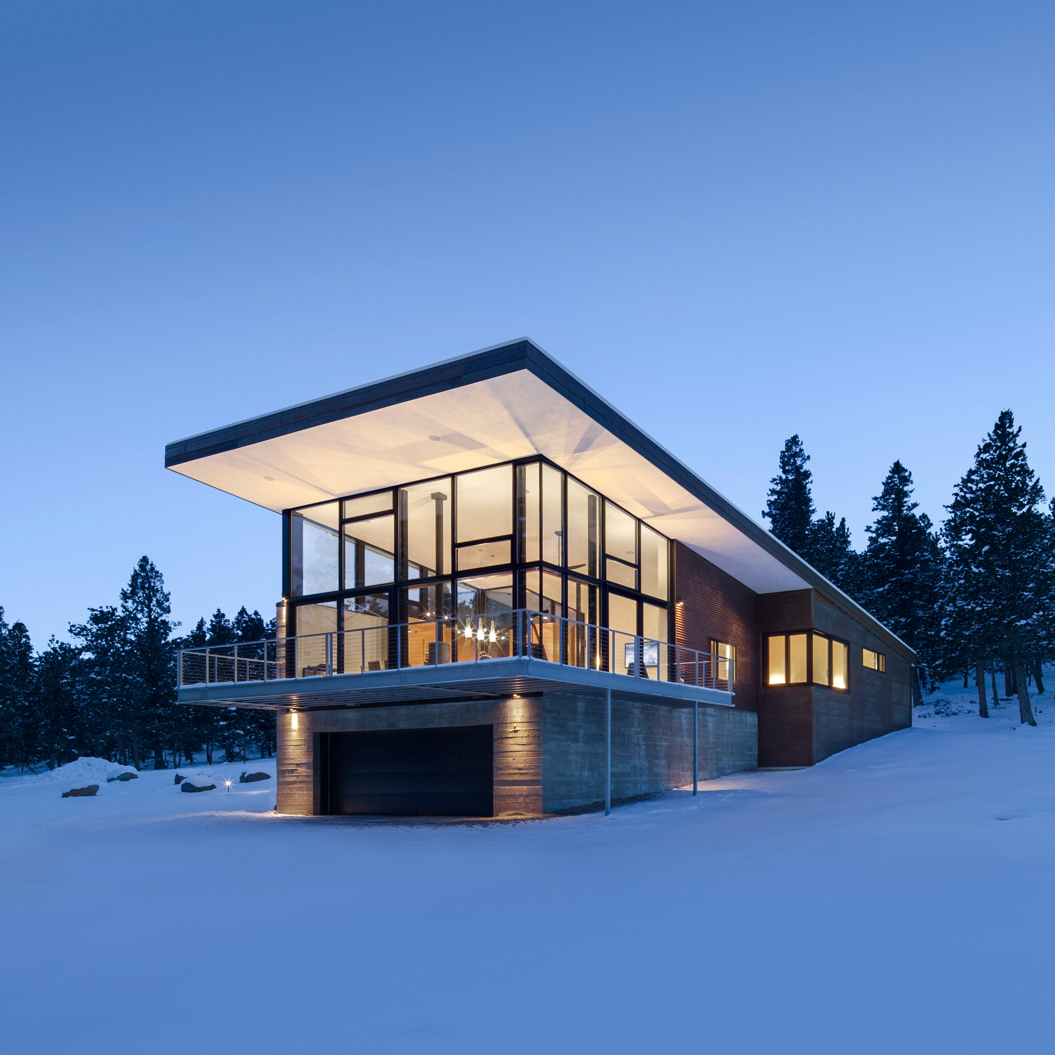 Arch 11 completes Rocky Mountain home atop a concrete plinth