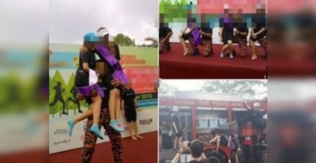FUHH !! Viral Gambar Bomba Dukung 2 Gadis Di Bahu Dikecam Netizen
