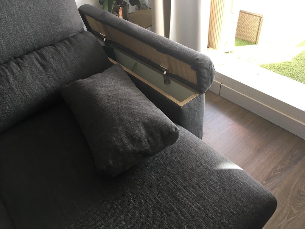 IKEA sofa with genius armrest storage Declutter And Organize