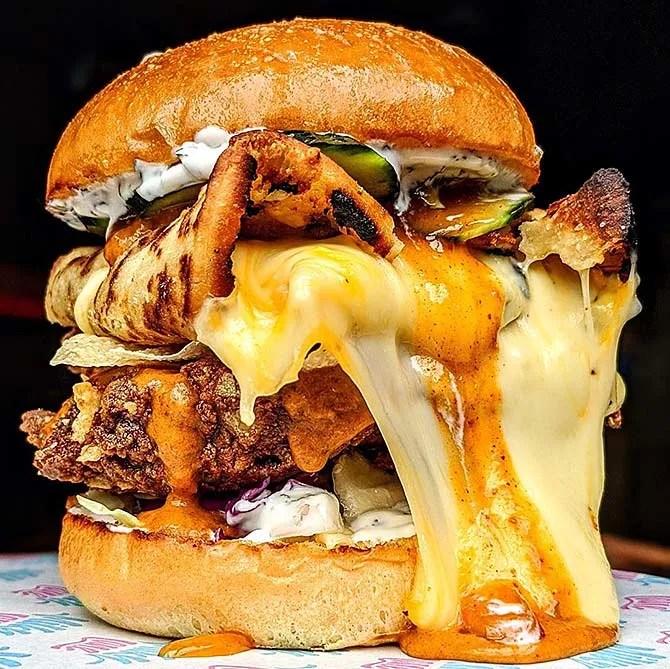 Have you tasted the fried butter chicken burger? Get Ahead