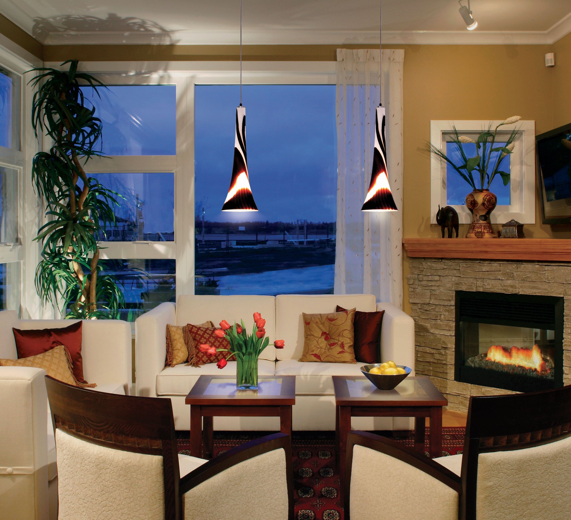 Sundae Collection art glass pendants in a casually modern room. Lamps