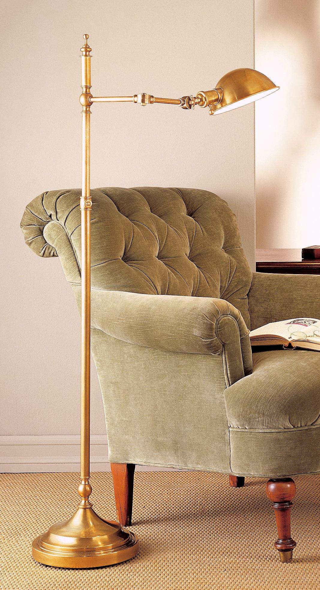 A reading chair with a brass finish floor lamp. Lamps Plus