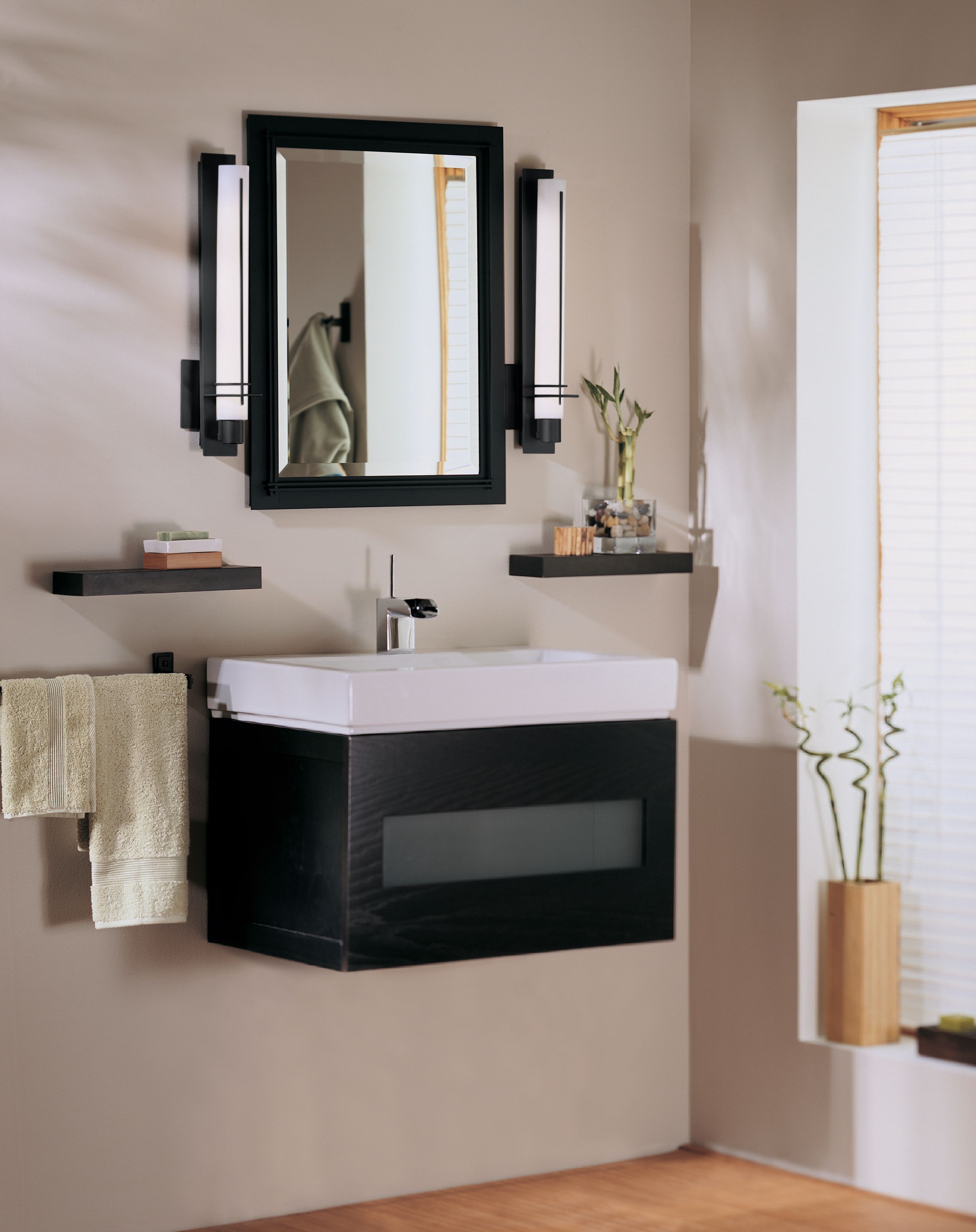 Energy efficient ADA wall lights mounted on either side of a bath