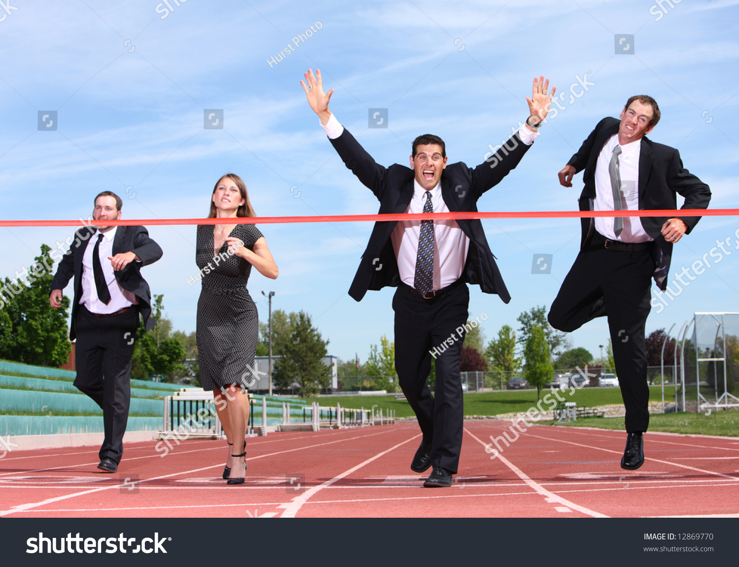 Businesspeople crossing the finish line Royalty Free Stock Photo