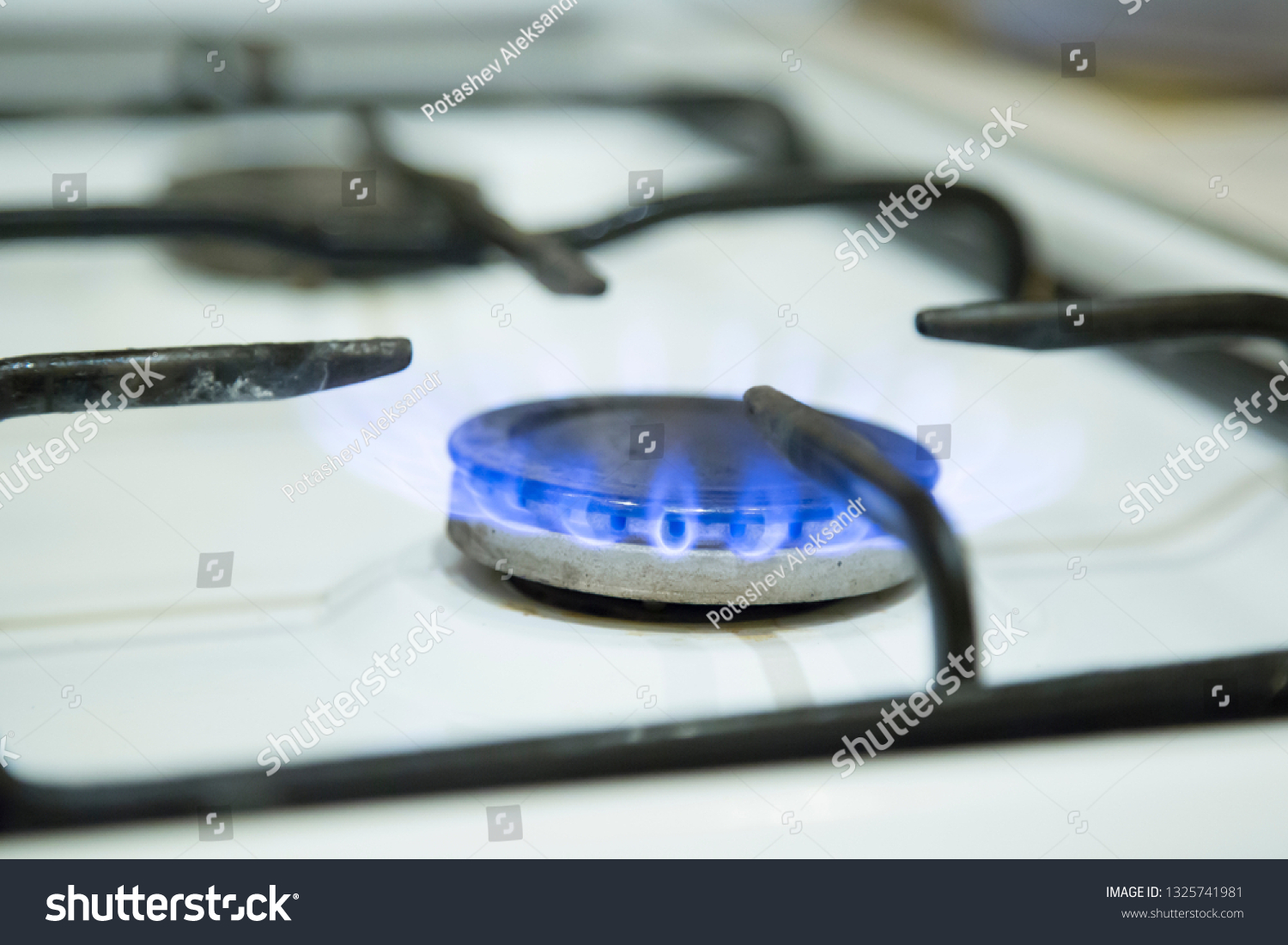 blue flames of gas stove Royalty Free Stock Photo 1325741981