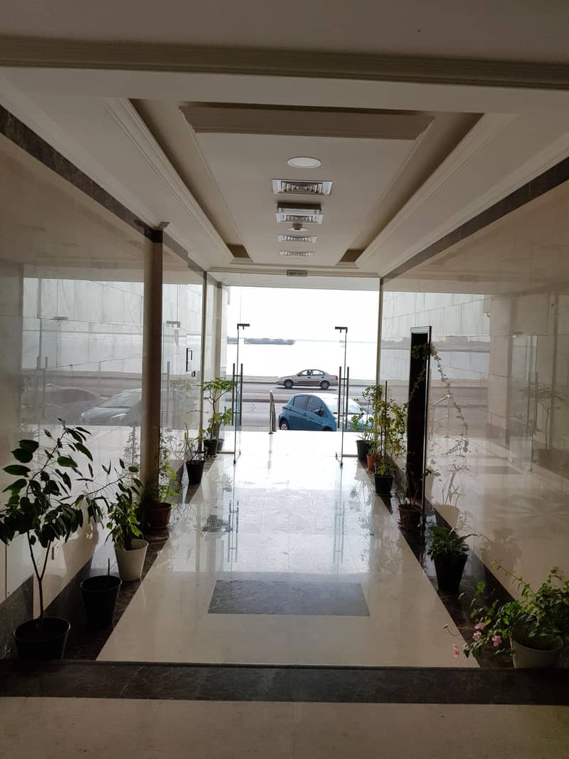 For rent in Umm Al Quwain a new building available 3 room + Hall , a