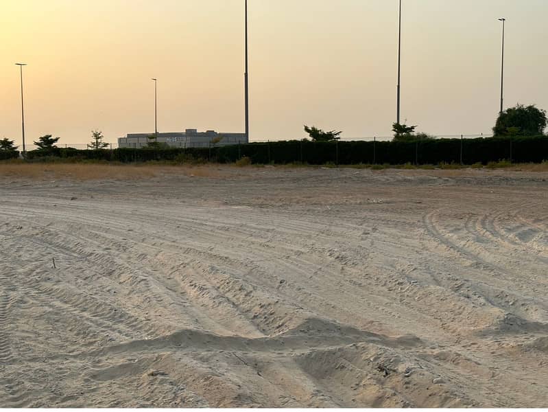 freehold Land for sale, a hospital permit in Al Qusais, a main street