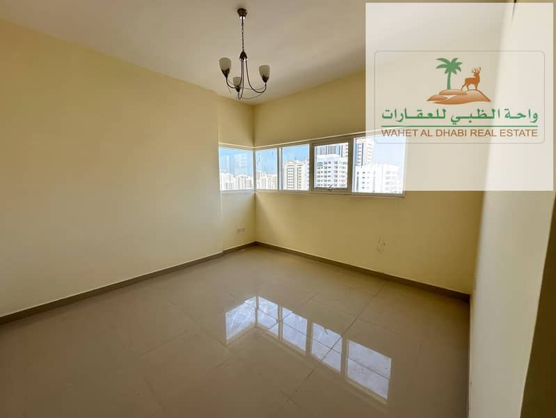 Two rooms and a hall for annual rent in Sharjah on Al Wahda Street, the