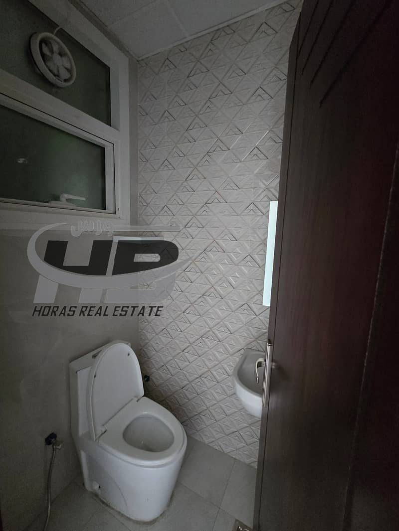 Twobedroom apartment with a hall for rent in Al Jurf 2, opposite the