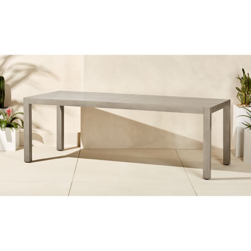 Enjoy summery meals with your family with one of our stylish garden dining sets. matera large grey outdoor dining table | CB2