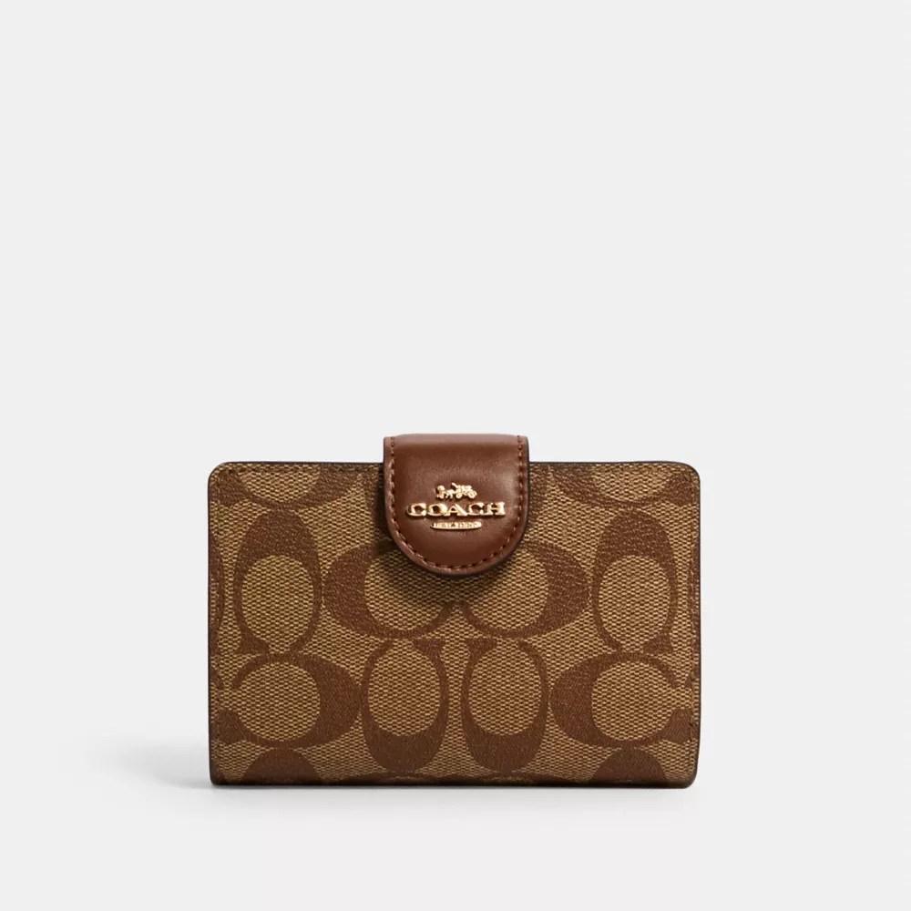 Brown Coach wallet with zipper