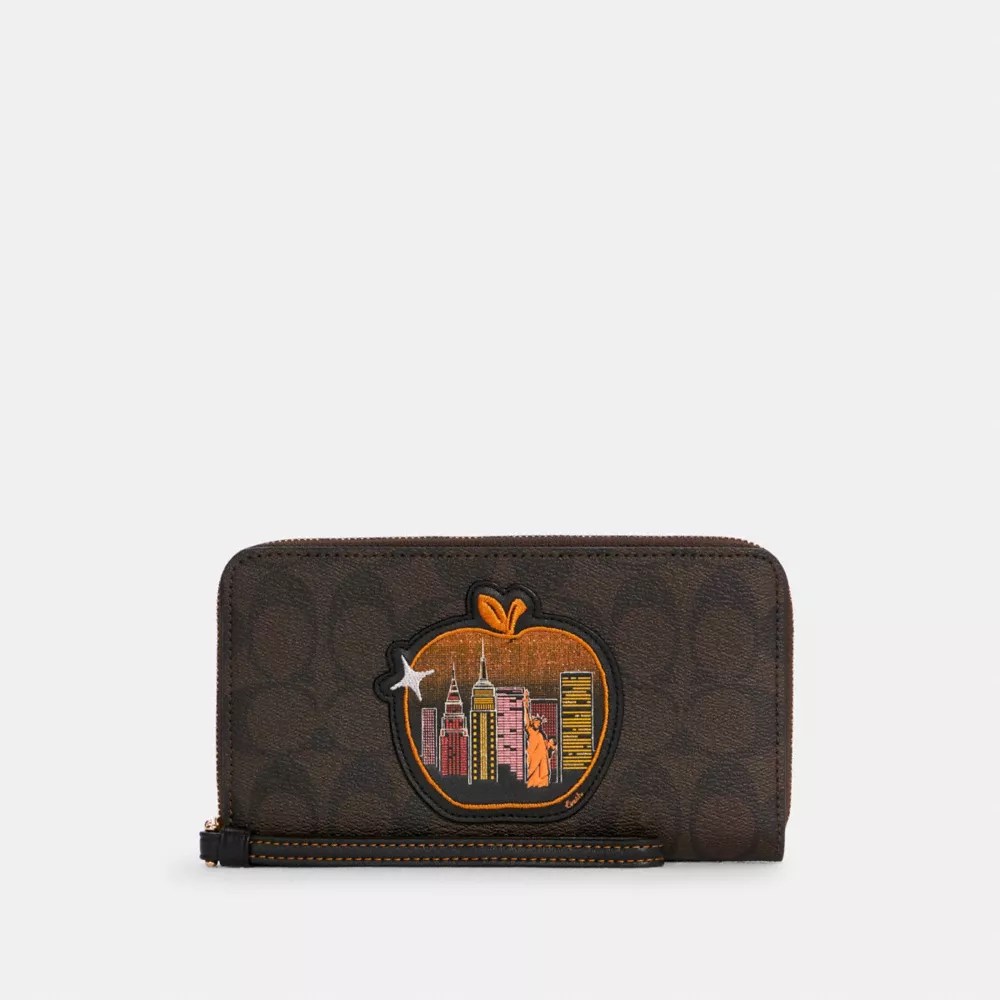 COACH® Dempsey Large Phone Wallet In Signature Canvas With Souvenir