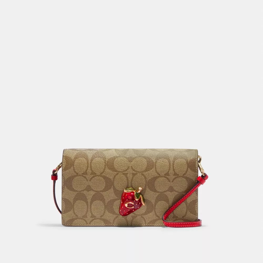 COACH® Anna Foldover Clutch Crossbody In Signature Canvas With Strawberry