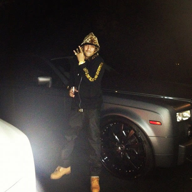 Juicy J 30 Photos of Rappers Flexing With Giant Car Rims Complex