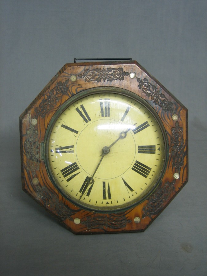 A 19th Century postman's alarm clock with painted dial 20th October