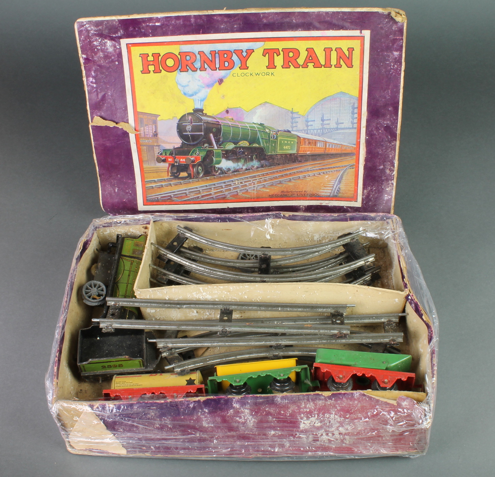 A Hornby clockwork train set, boxed, in battered 3rd June 2015 Denhams
