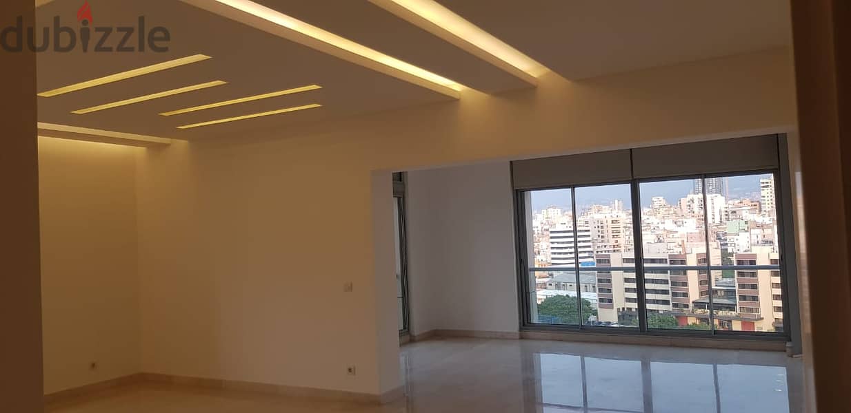 L14459Apartment with Panoramic City View for Rent in New Achrafieh Apartments & Villas For