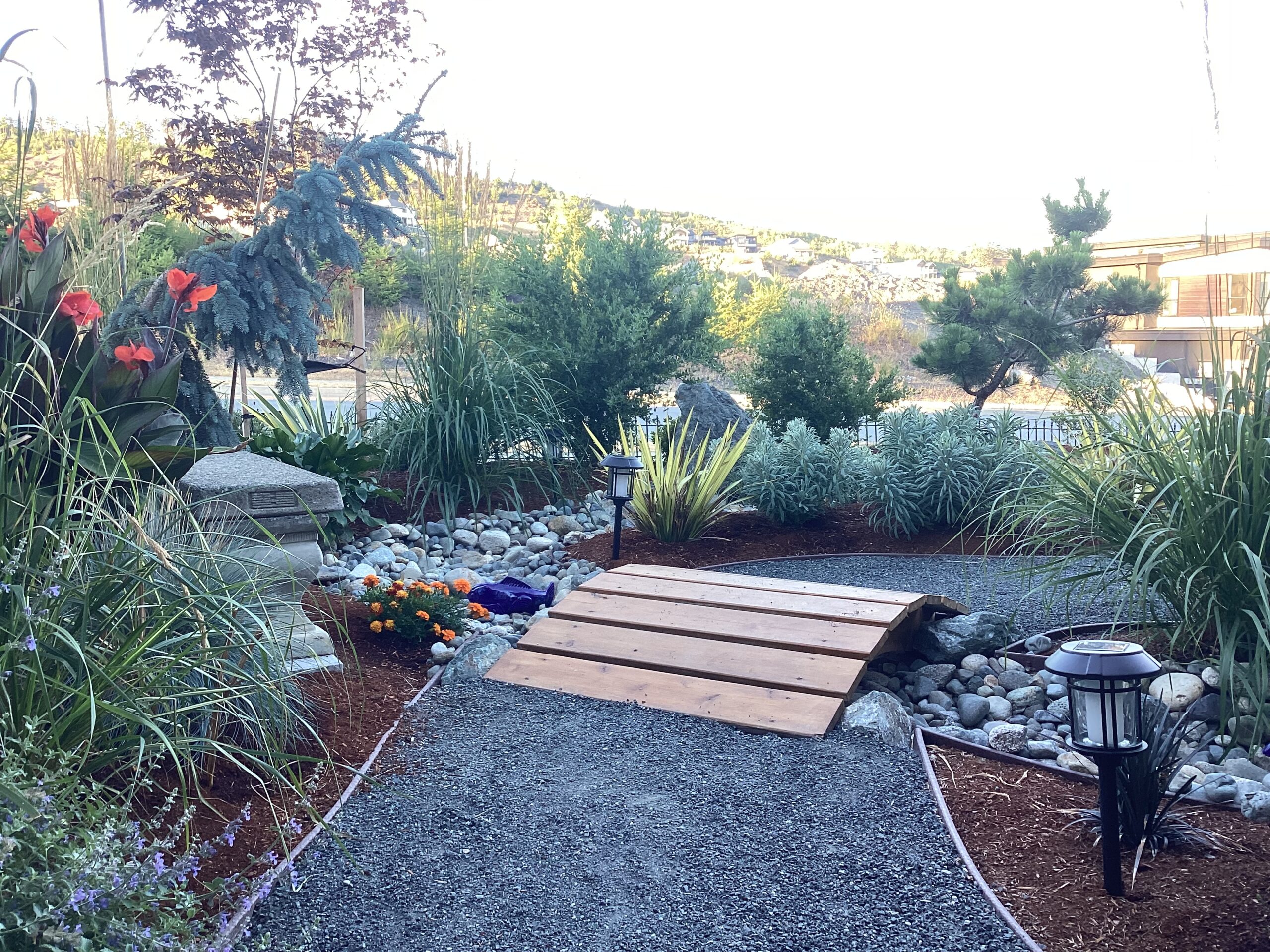 small wooden bridge over the dry steam bed