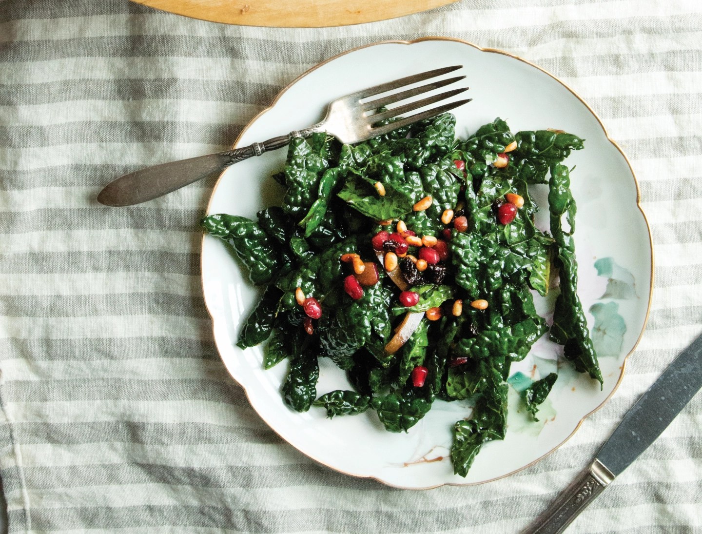 Tuscan Kale Salad with Pomegranate, Pine Nuts + Currants