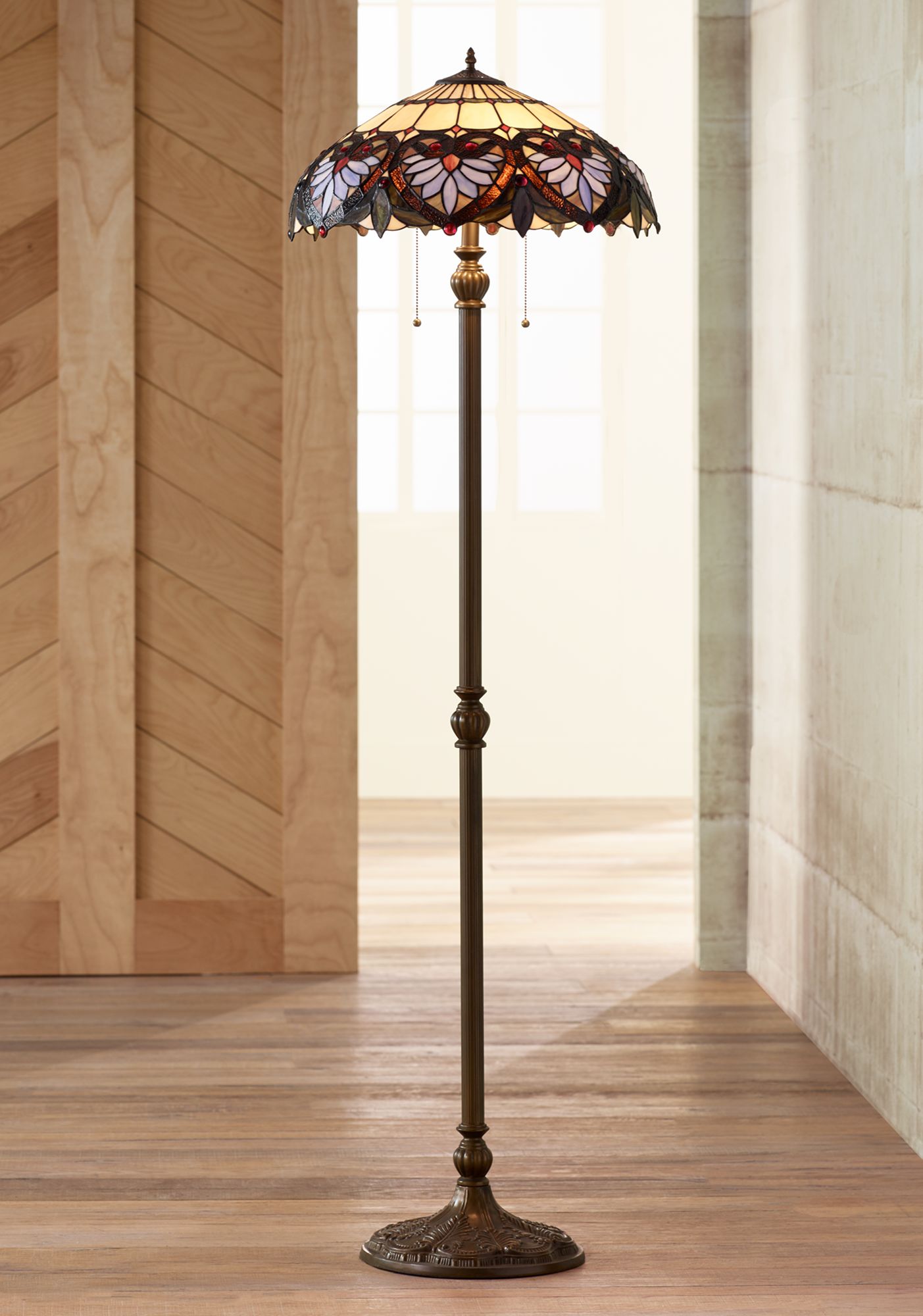 Stained glass floor lamp in the style of Tiffany with a traditional bronze rod