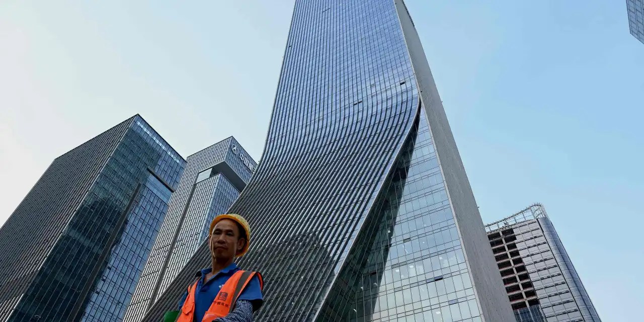 China’s Evergrande once again sidesteps default, while sector rallies on signs of Beijing ease