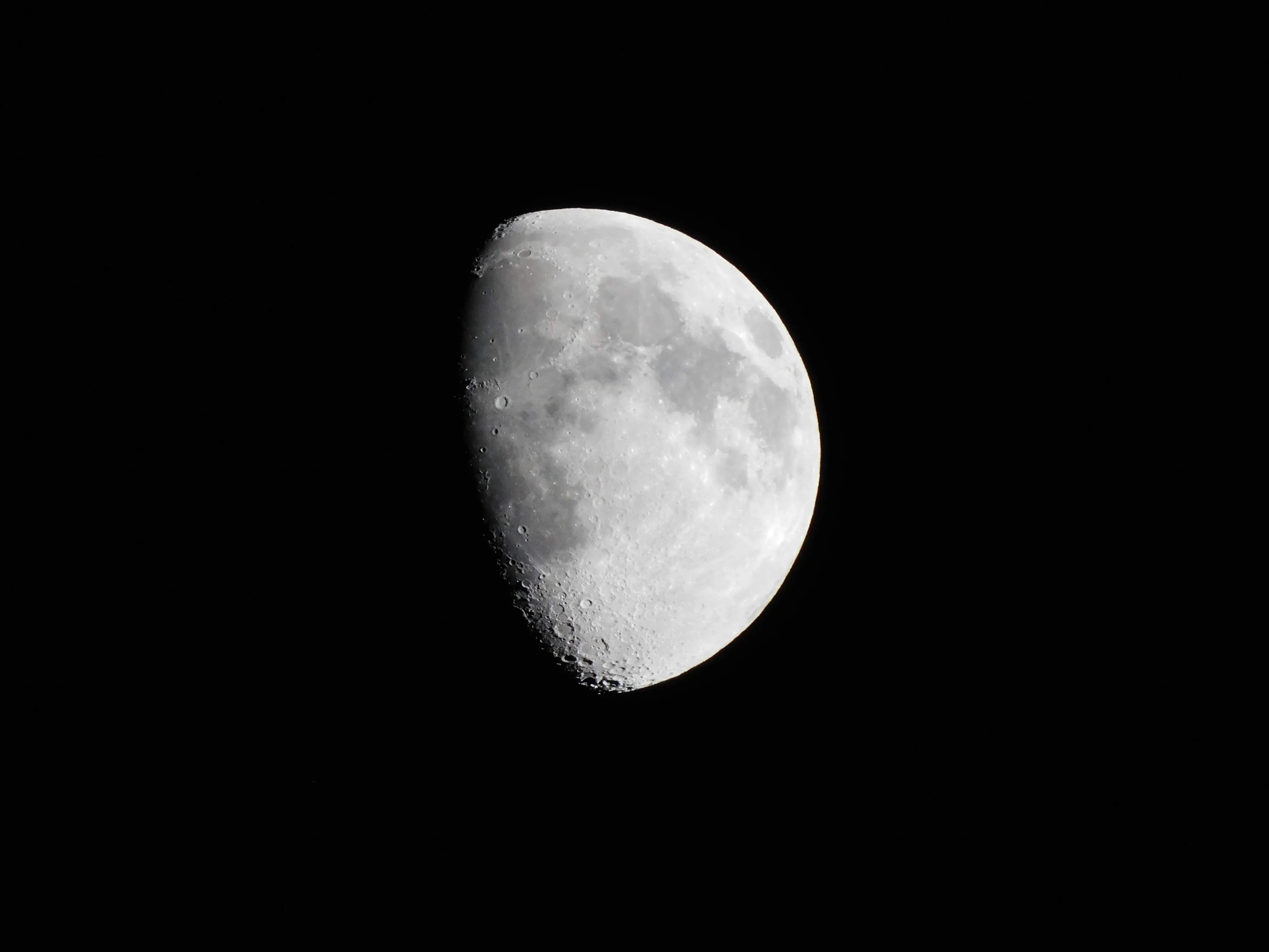 A detailed image of the waxing gibbous moon showcasing craters and features against a dark sky.
