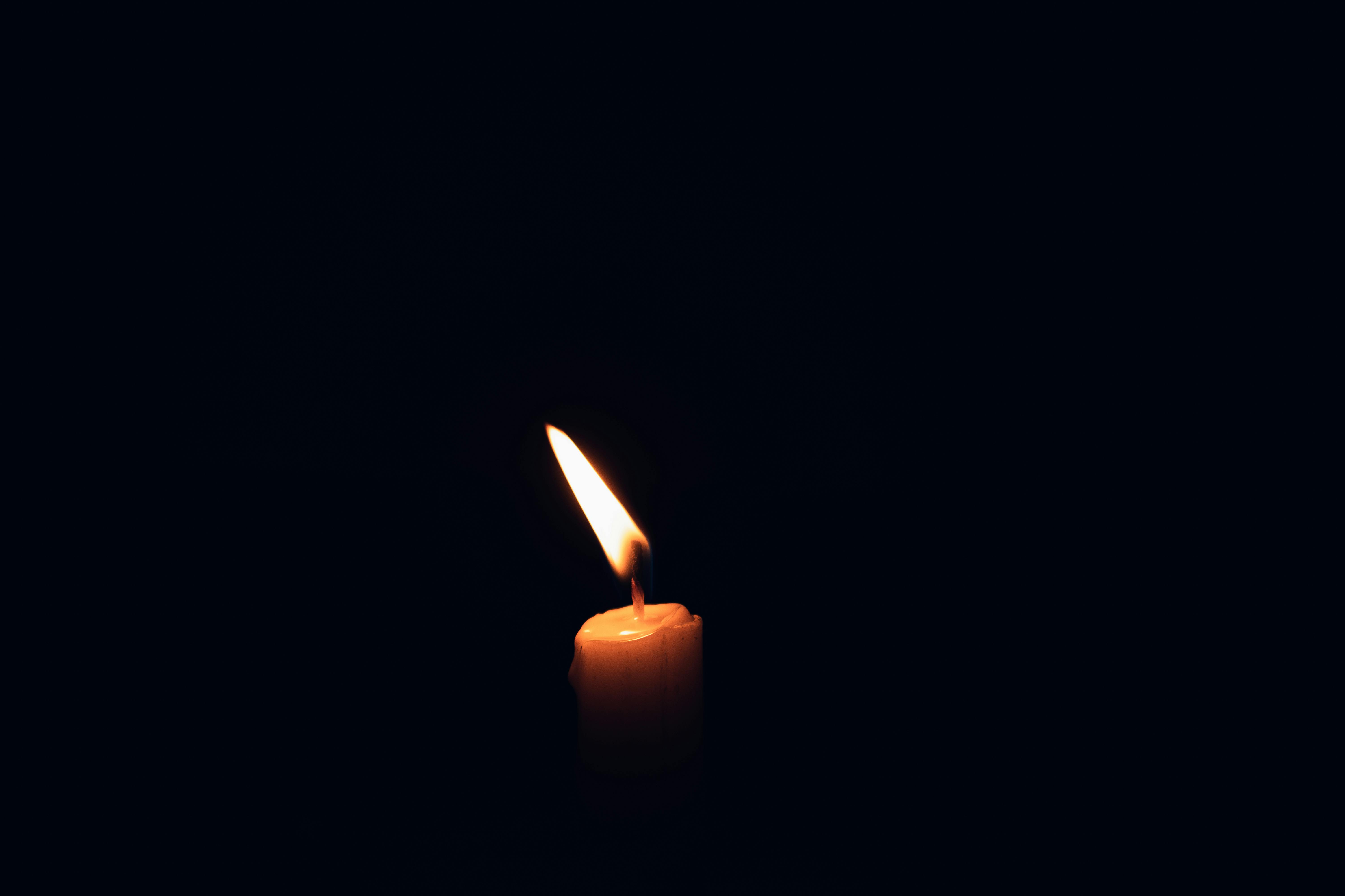 Lighted Candle in Dark Room · Free Stock Photo