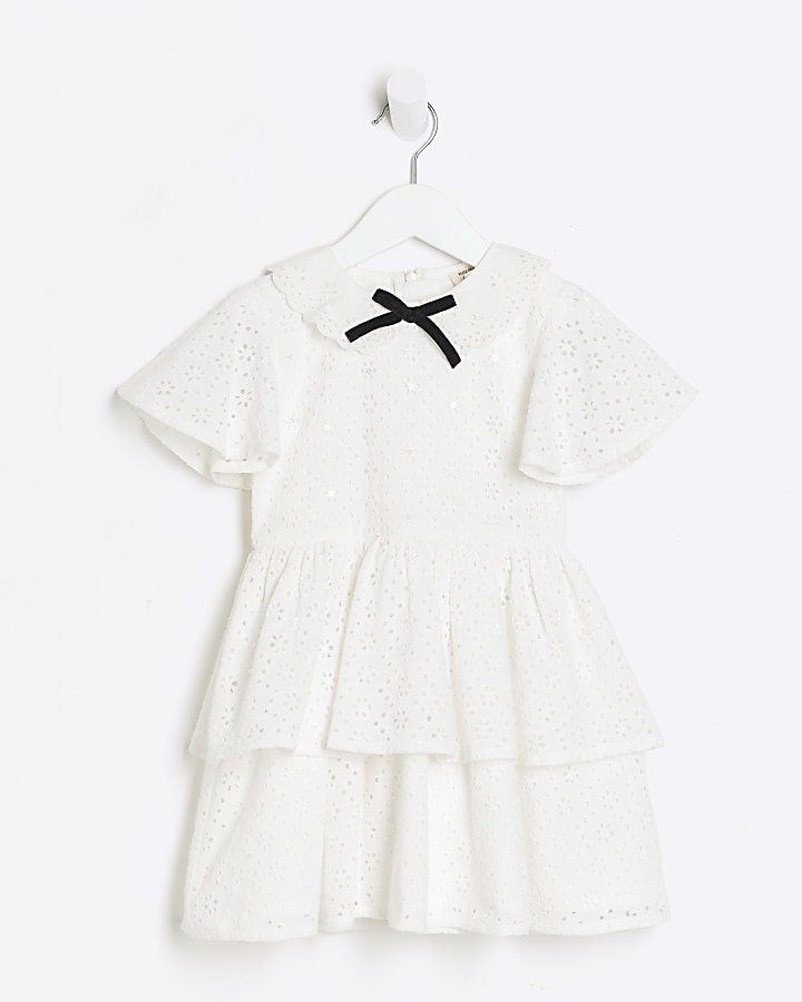 Mini girls white broderie bow skater dress River Island
