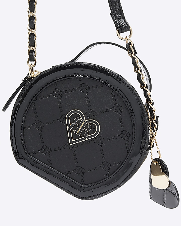 Girls black circle embossed cross body bag River Island