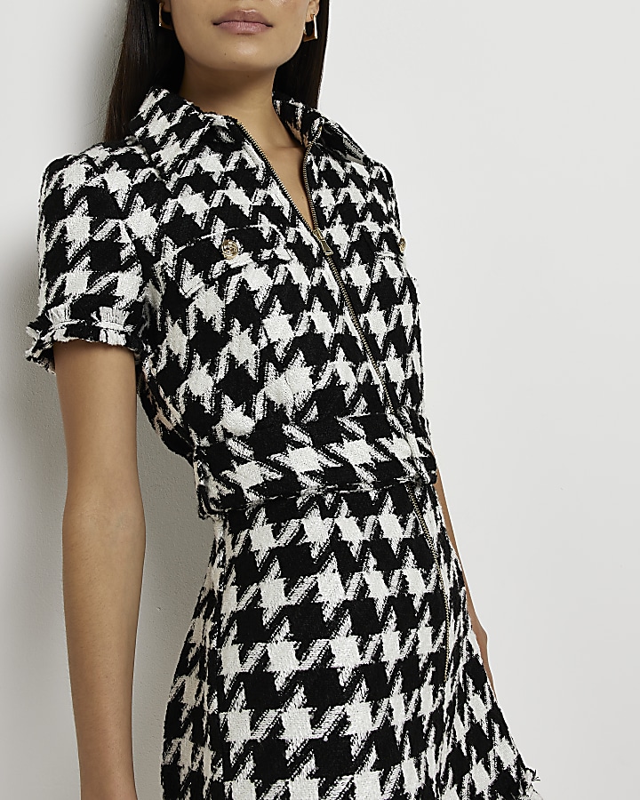 Black dogtooth boucle belted playsuit River Island