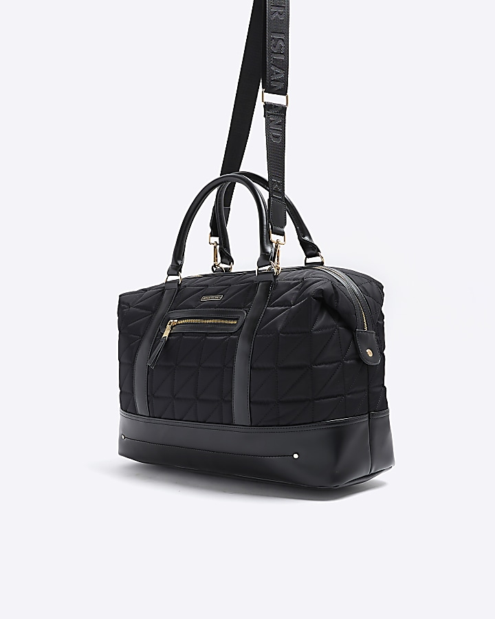 Black quilted zip travel bag River Island