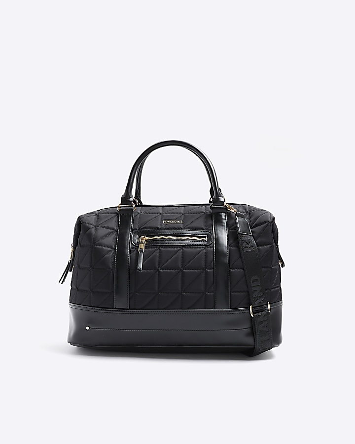 Black quilted zip travel bag River Island