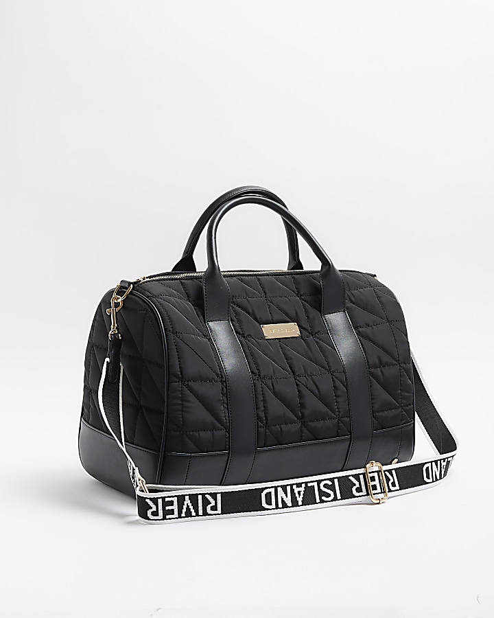 Black quilted travel bag River Island