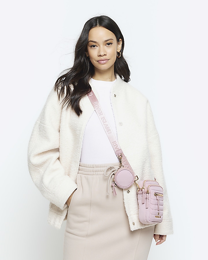 Pink quilted phone cross body bag River Island