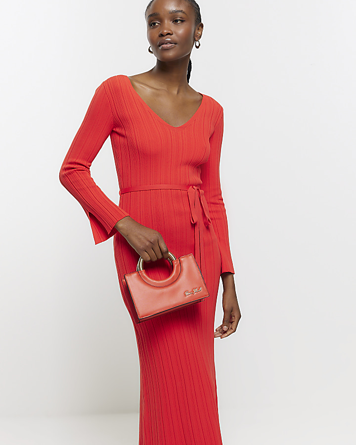 Orange circle handle cross body bag River Island