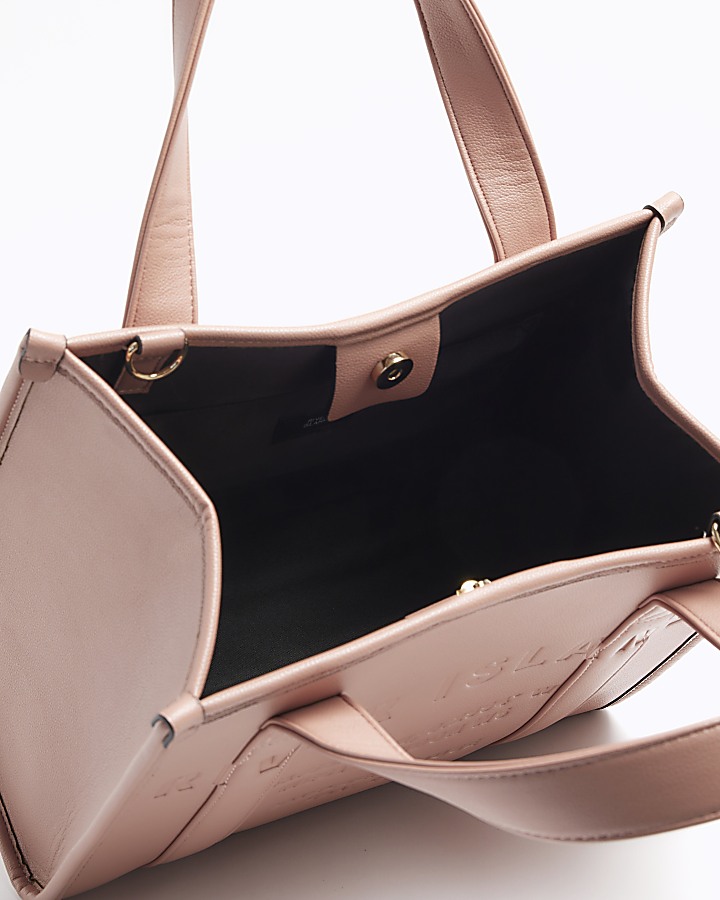Pink embossed cross body tote bag River Island