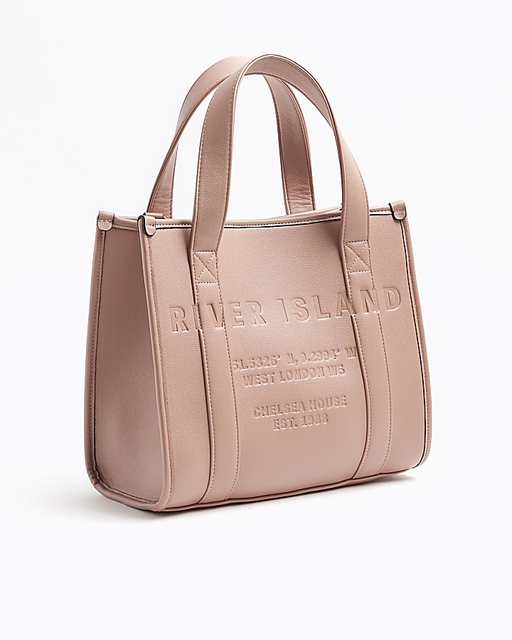 Pink embossed cross body tote bag River Island