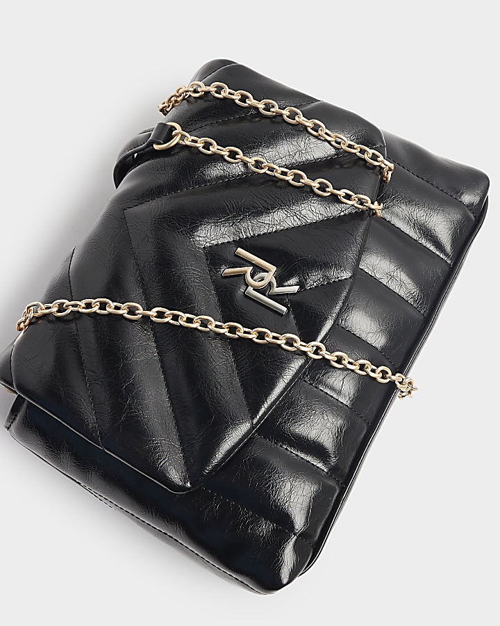 Black quilted chain strap shoulder bag River Island