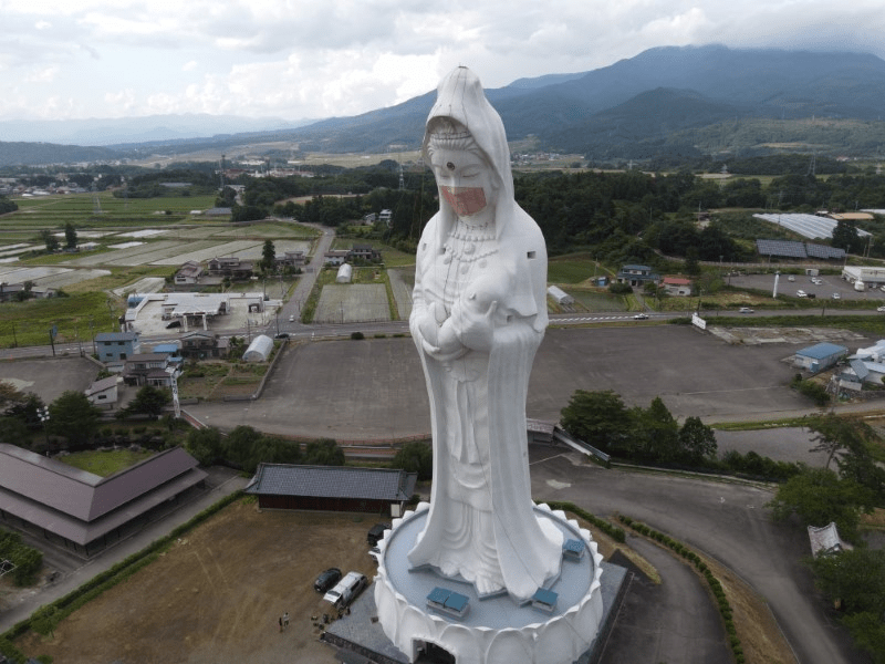 Face Mask Placed On Giant Guanyin Statue In Japan To Pray For The End