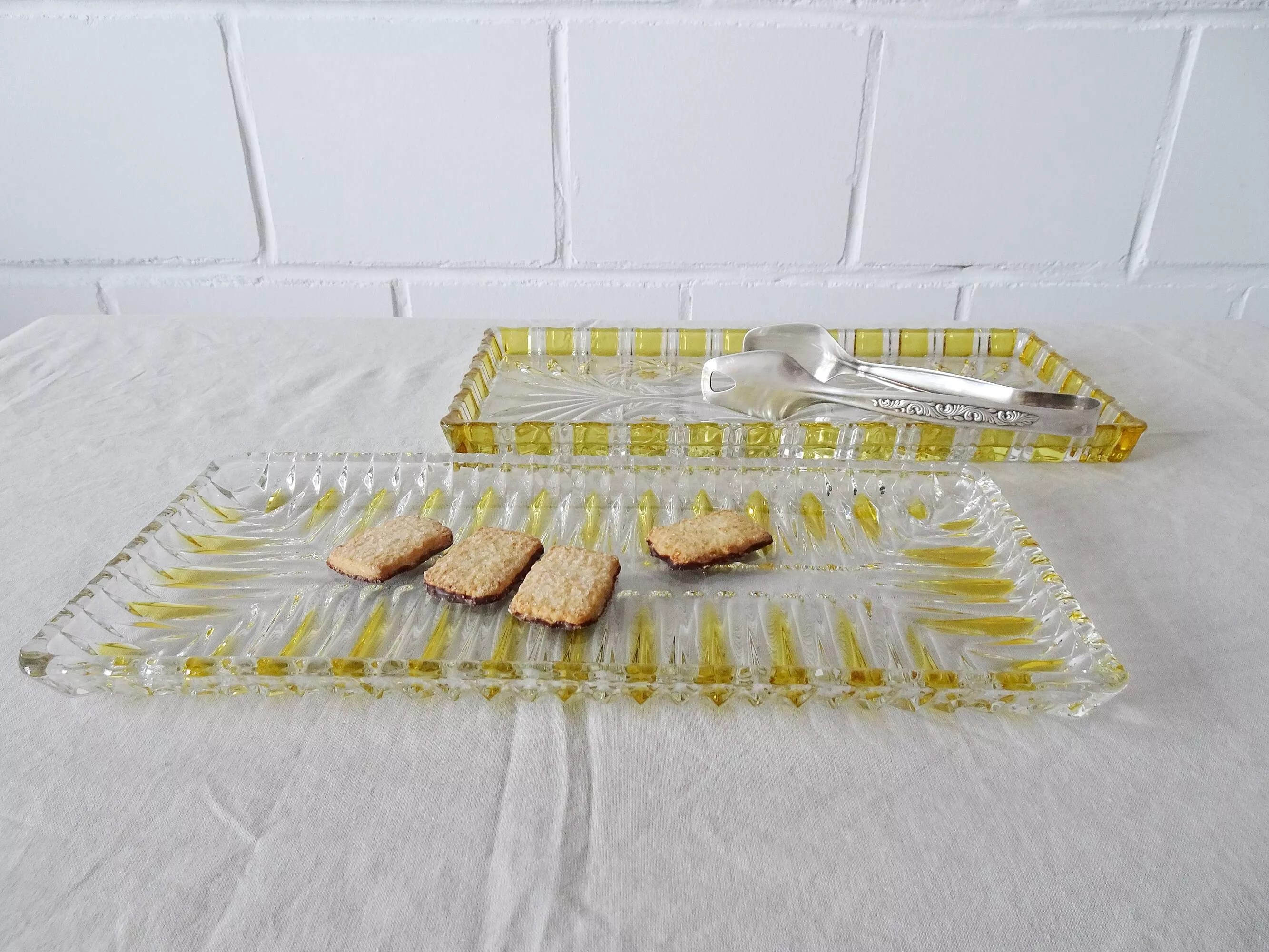 Set of two Walther glass serving plates in yellow, Walther crystal