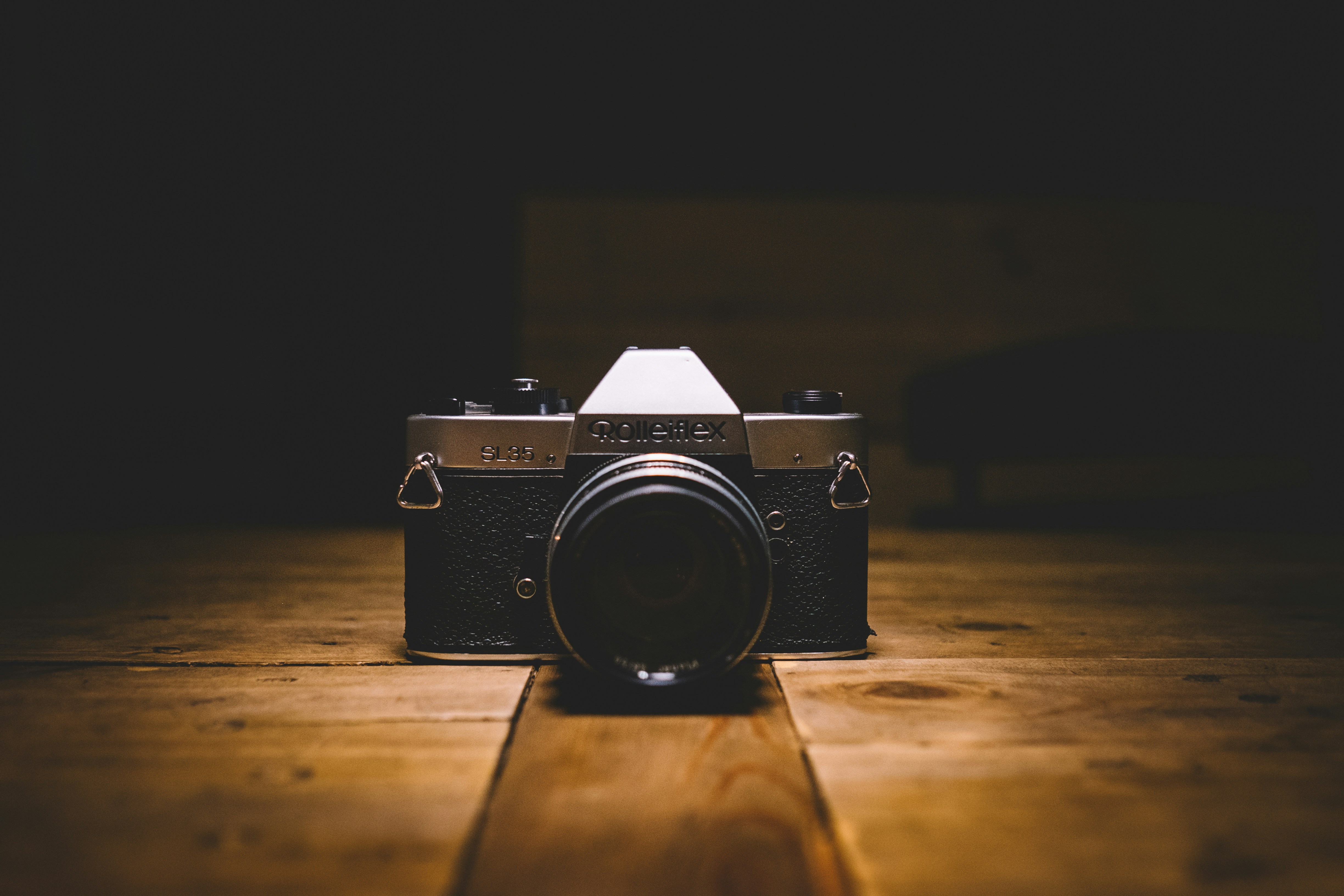 black and gray SLR camera on floor photo Free Camera Image on Unsplash