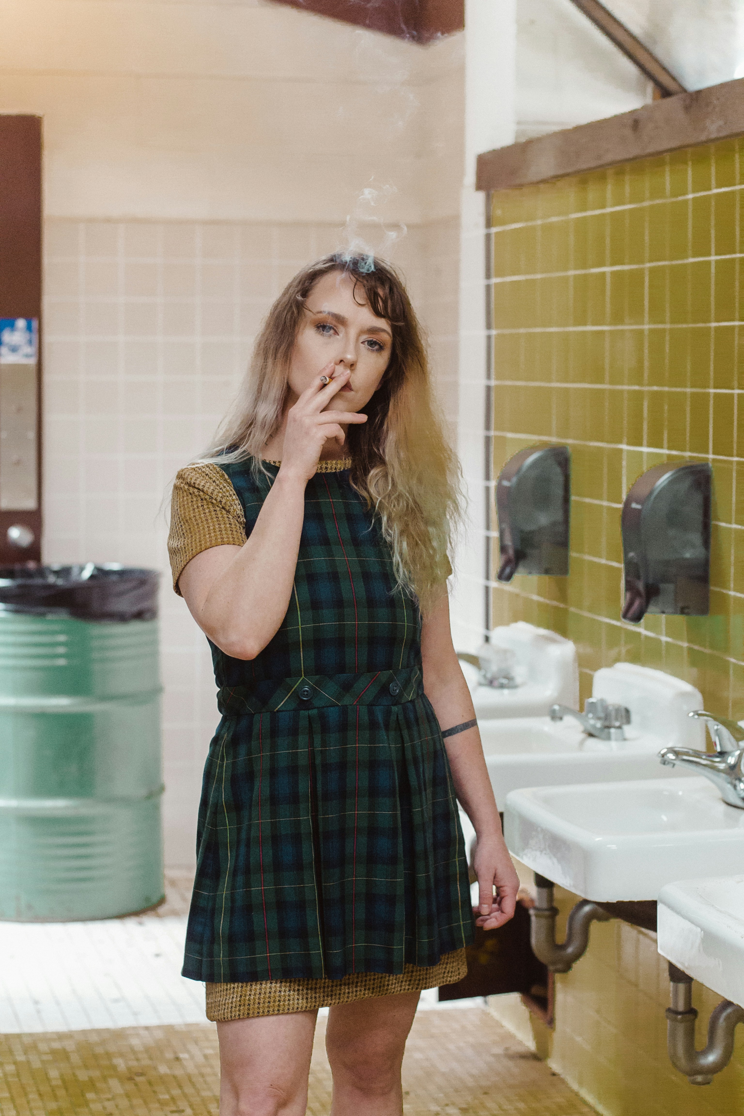 woman smoking cigarette inside bathroom photo Free Person Image on