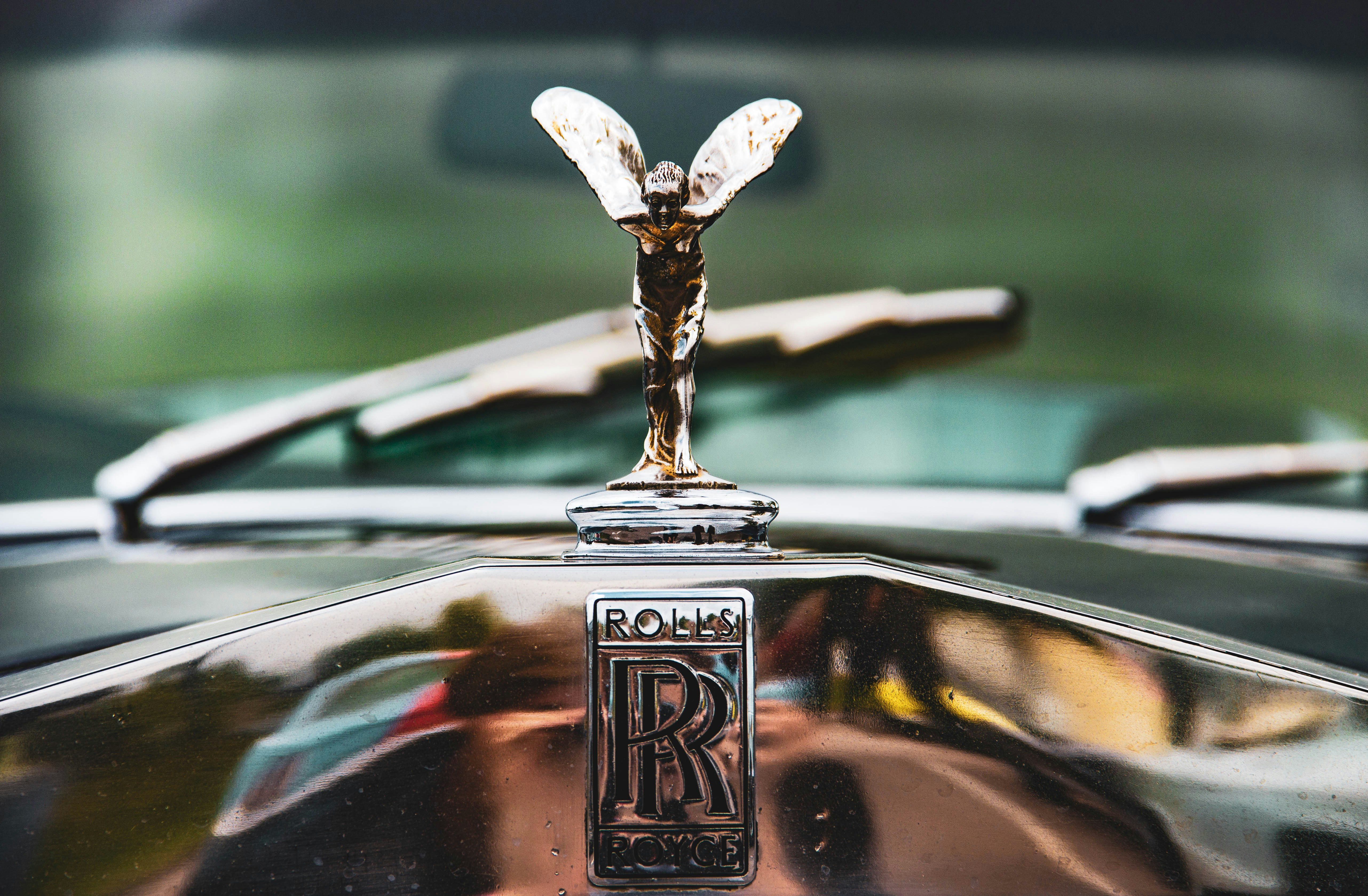 silver Rolls Royce emblem photo Free Logo Image on Unsplash