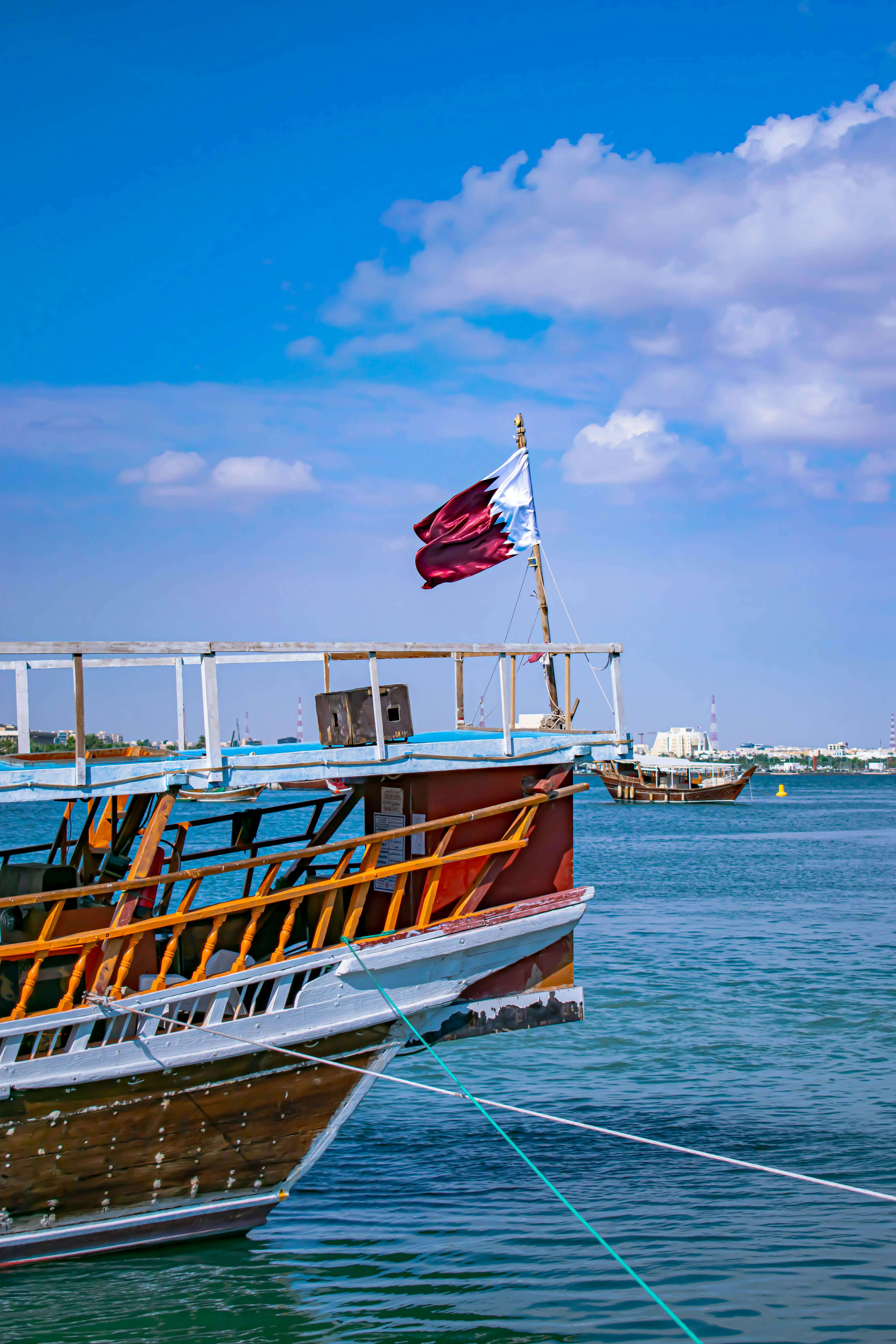boat with red and white flag photo Free Transportation Image on Unsplash