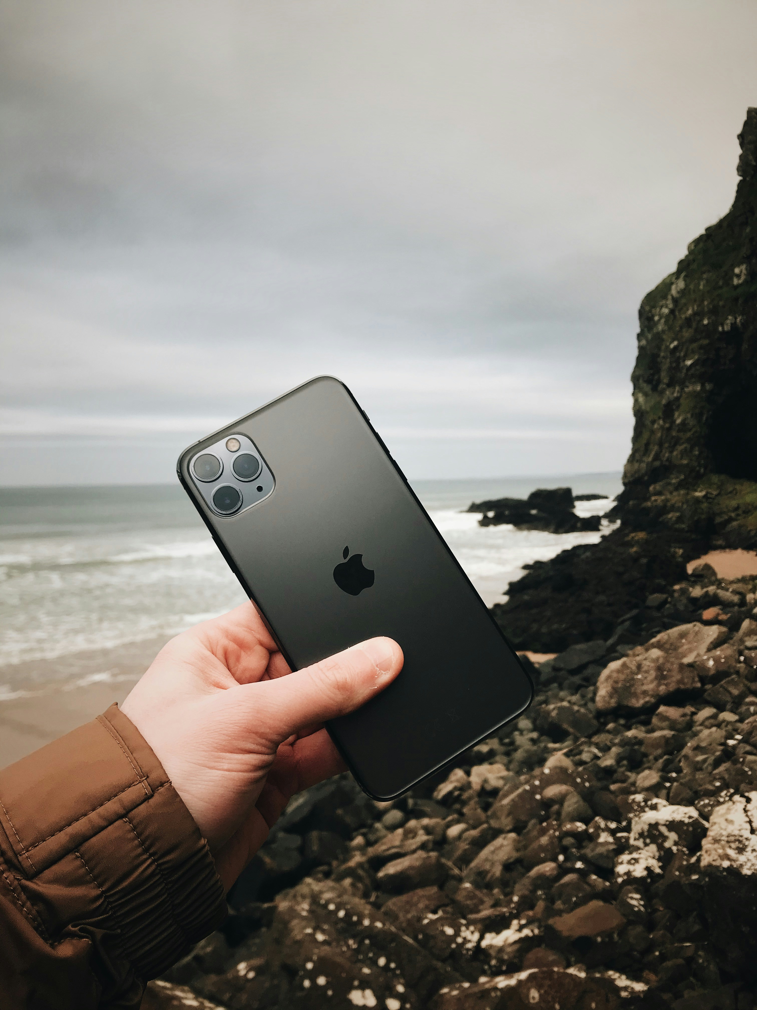 unknown person holding silver iPhone 11 photo Free Cell phone Image